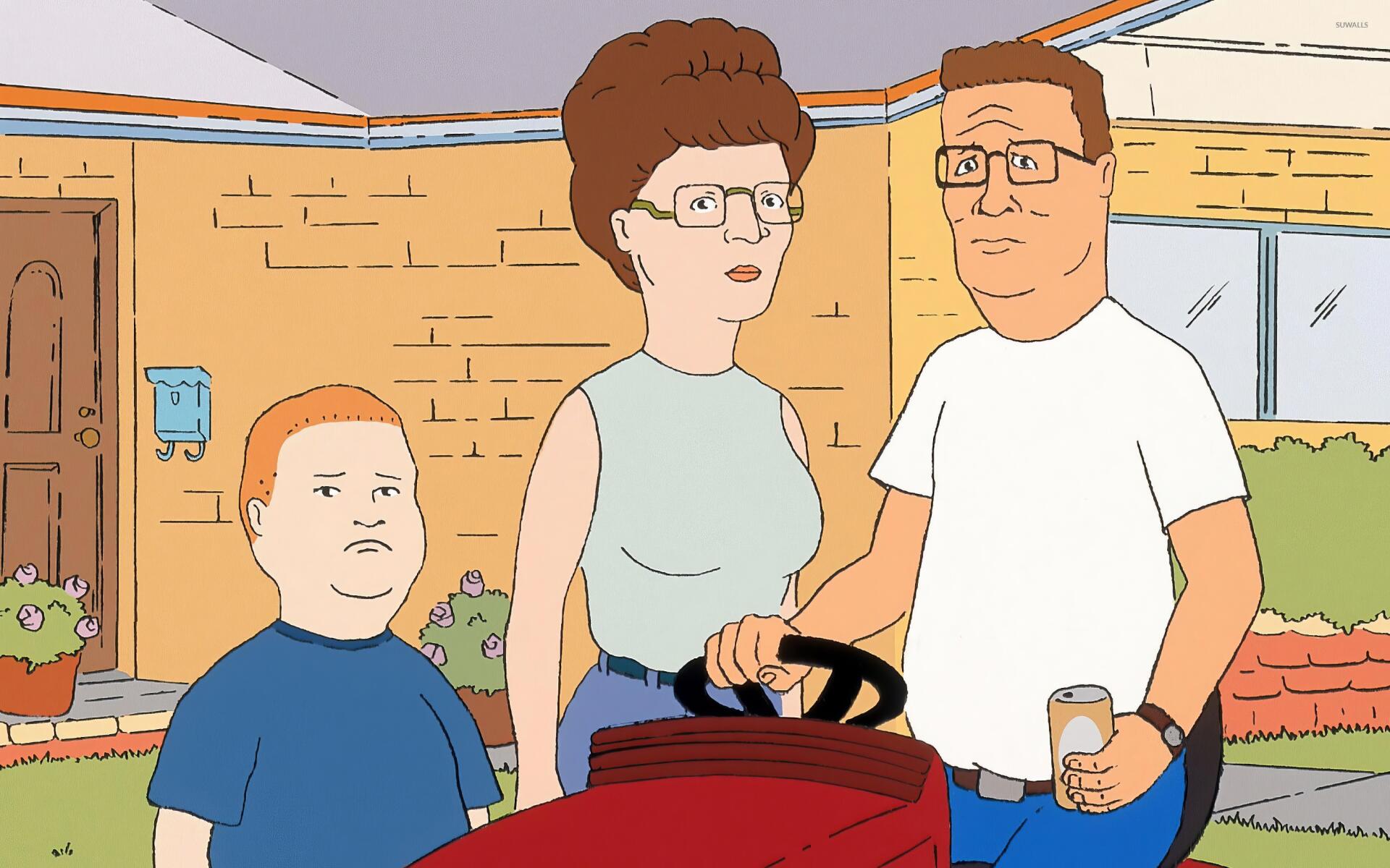 HD PC desktop wallpaper featuring the Hill family—Bobby, Peggy, and Hank—from the TV show King Of The Hill standing outdoors in front of their house.