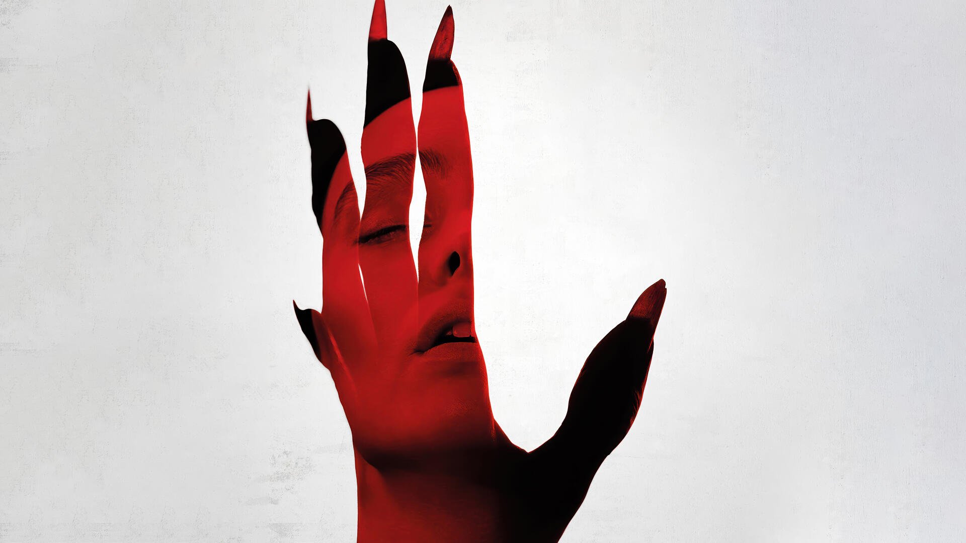 Nosferatu (2024) 4K Ultra HD desktop wallpaper featuring a red-tinted hand with black nails partially obscuring a pale face in the background.