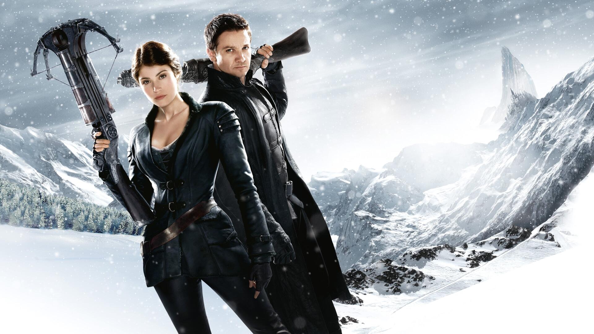 Hansel & Gretel: Witch Hunters 4K Ultra HD PC desktop wallpaper - two leather-clad hunters with crossbow and rifle stand amid a snowy, windswept mountain landscape.