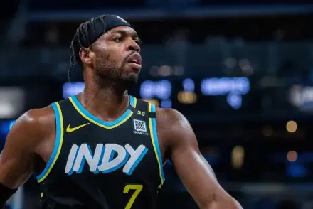 HD desktop wallpaper featuring Indiana Pacers player Buddy Hield in action, wearing a black jersey with INDY and number 7.