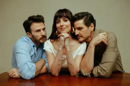 HD PC desktop wallpaper featuring Chris Evans, Dakota Johnson, and Pedro Pascal from the movie Materialists, posed closely around a table.