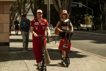 Rose Byrne and Seth Rogen riding e-scooters in a scene from the TV show Platonic, captured in 4K Ultra HD quality for a PC desktop wallpaper.
