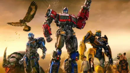 Transformers: Rise of the Beasts 4K Ultra HD PC desktop wallpaper: Optimus Prime, Bumblebee and another Autobot stand with two humans beneath a golden sky as a hawk soars.