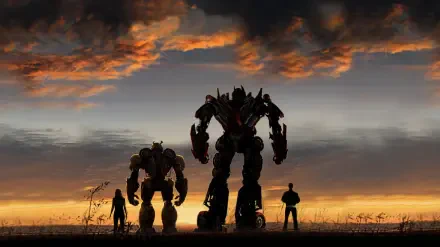 Bumblebee (movie) HD PC desktop wallpaper background: silhouetted Autobots and human figures stand on a field beneath a dramatic sunset and cloud-filled sky.