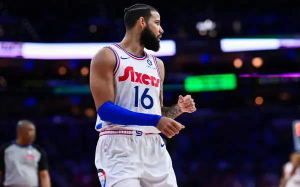 Caleb Martin of the Philadelphia 76ers showcases his skills during an NBA game, captured in a vibrant 4K Ultra HD background.