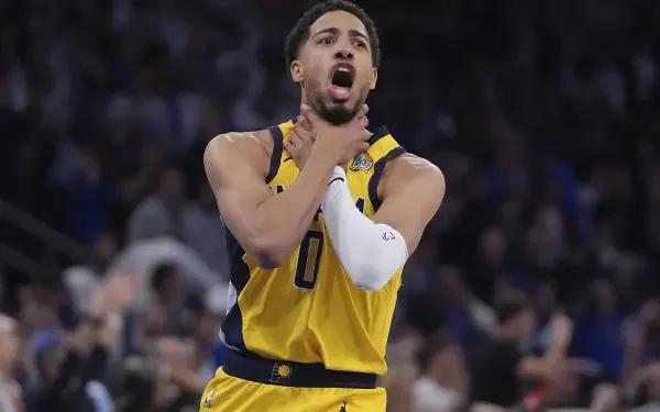 HD desktop wallpaper featuring Indiana Pacers' Tyrese Haliburton passionately reacting during an NBA game.