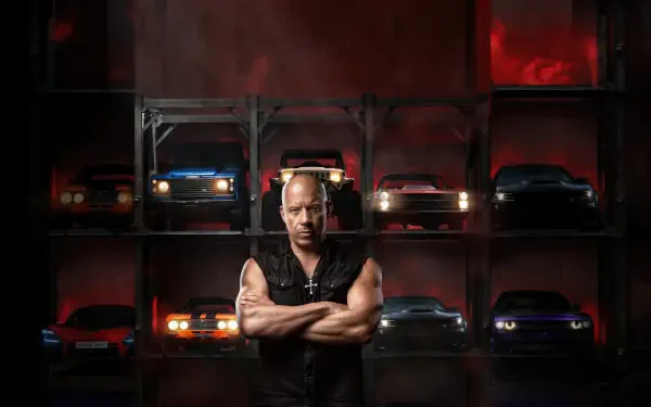 Bald, muscular man with arms crossed stands before stacked sports cars in moody red lighting — Fast X 4K Ultra HD PC desktop wallpaper and background.