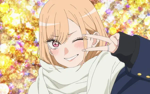 Anime HD PC desktop wallpaper of Marin Kitagawa (My Dress-Up Darling): she winks and flashes a peace sign, wearing a scarf and jacket against a sparkling gold background.