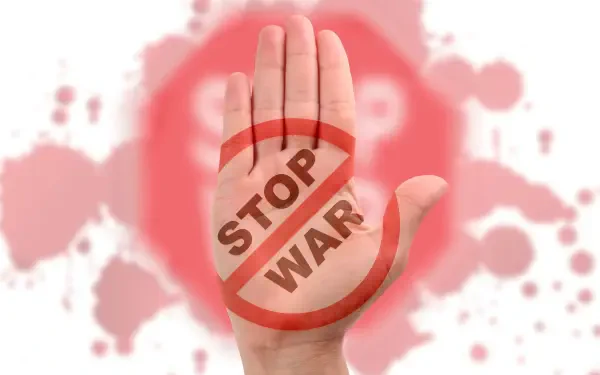 HD PC desktop wallpaper: an open hand with a red STOP WAR sign stamped on the palm against a peace-themed background, symbolizing no war.
