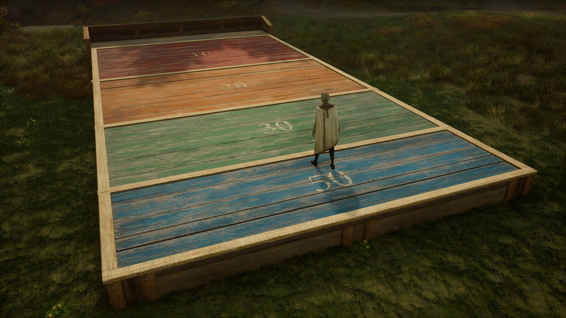 4K Ultra HD PC desktop wallpaper/background from the video game Hogwarts Legacy: a cloaked figure stands on multicolored raised platforms in a grassy outdoor setting.