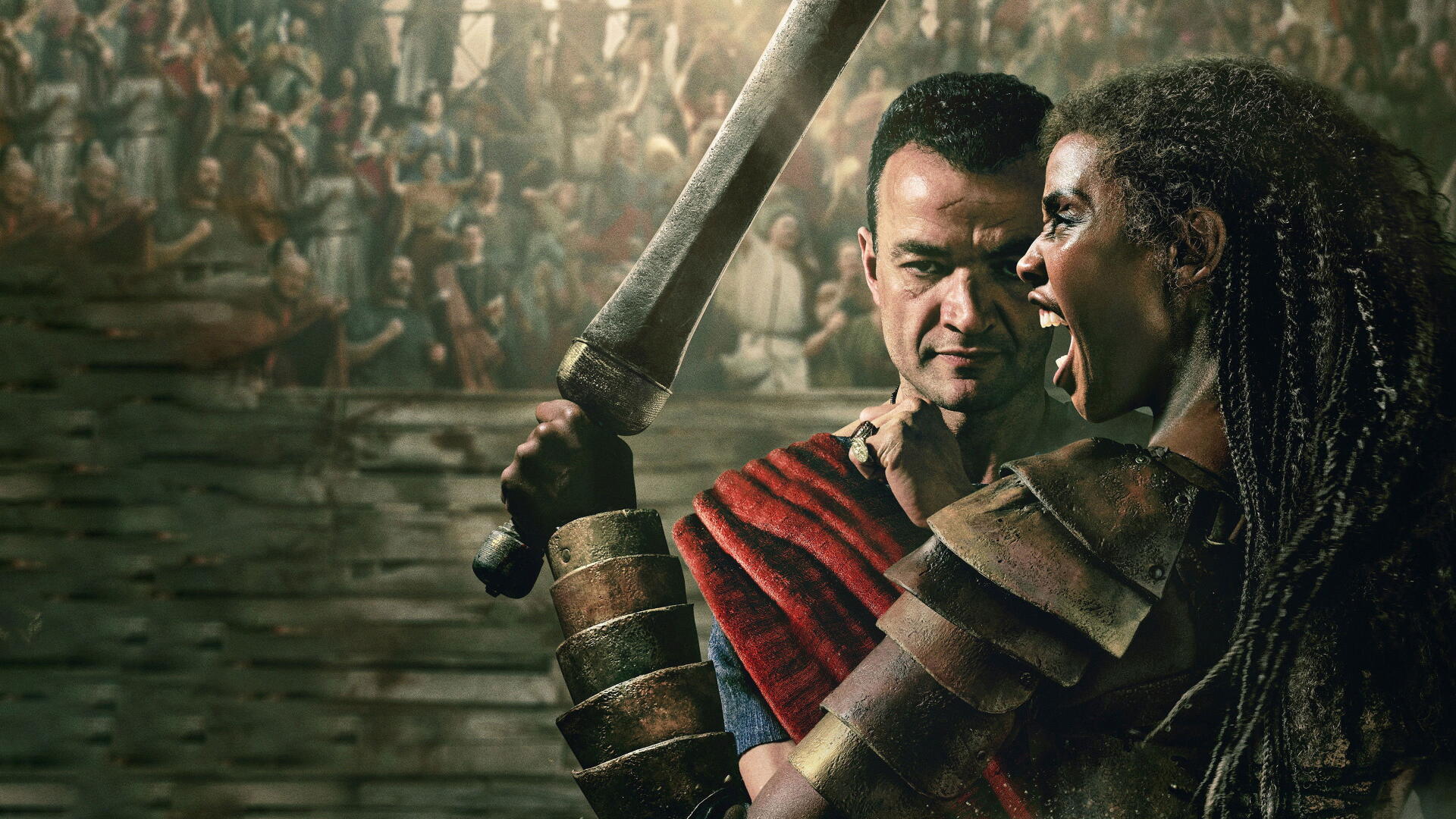 Spartacus: House of Ashur 4K Ultra HD PC wallpaper — two armored gladiators clash in a crowded arena, one brandishing a raised sword and the other screaming.