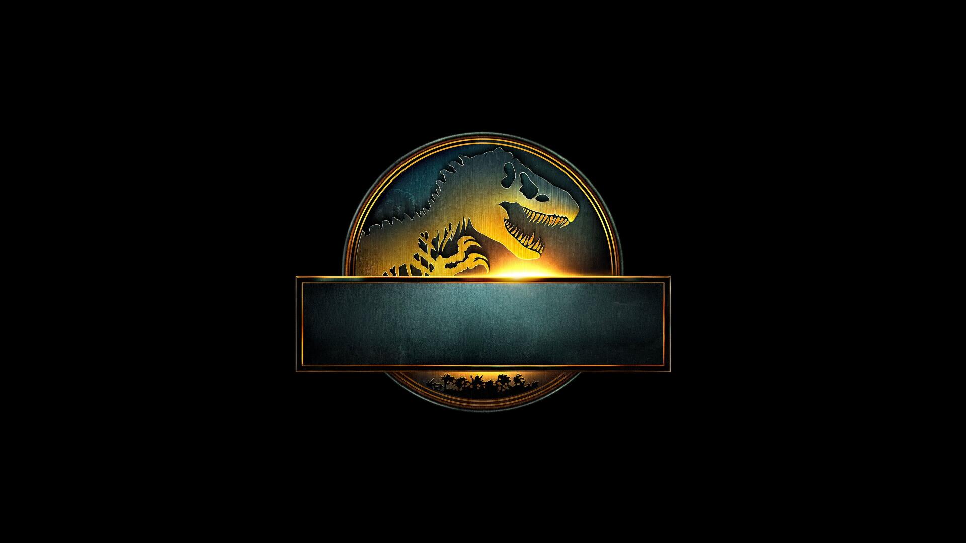 Jurassic World Rebirth emblem glowing on black: gold-rimmed circular logo with dinosaur silhouettes and an empty banner, rendered as a 4K Ultra HD PC desktop wallpaper background.