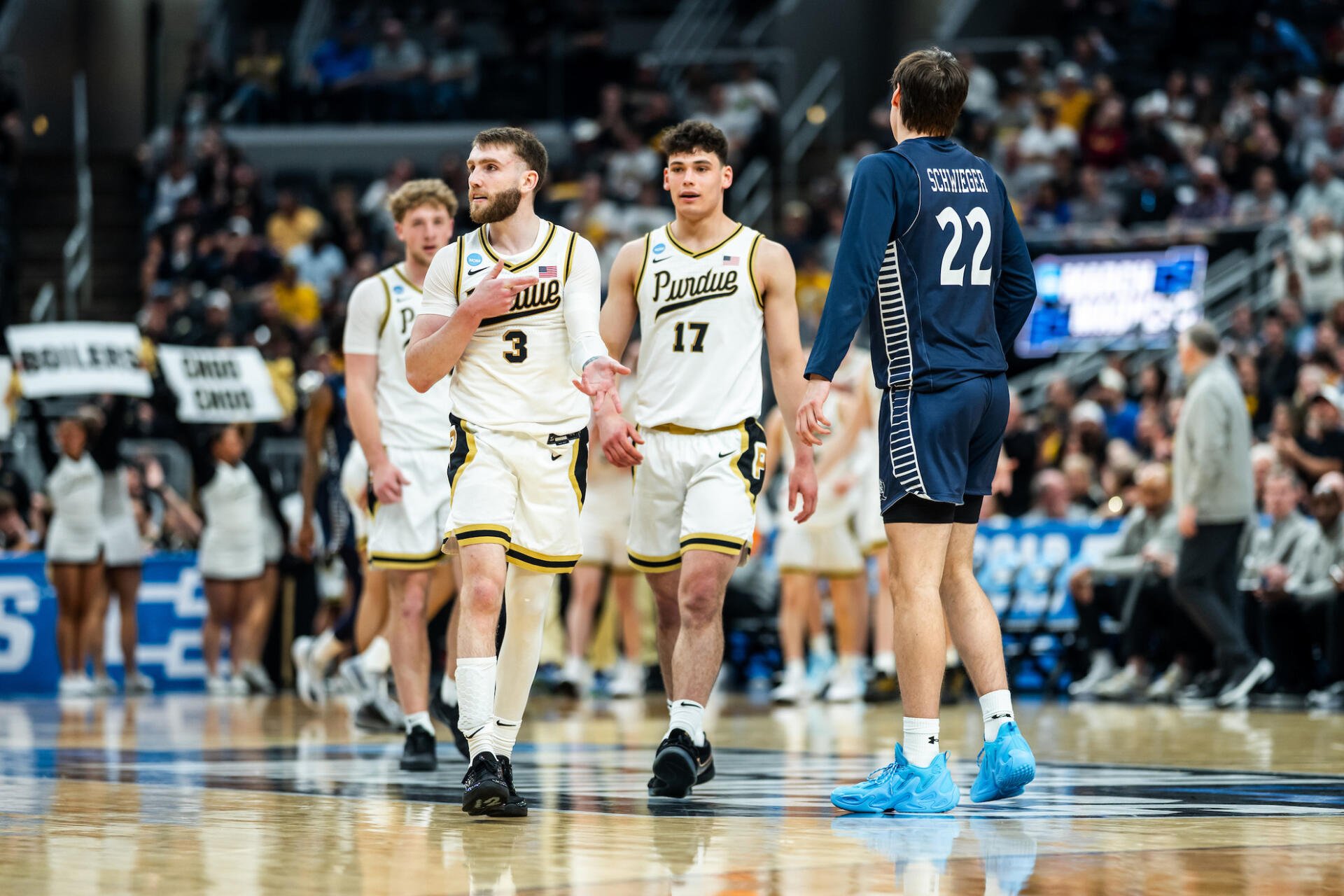 NCAA: Purdue Boilermakers players in white uniforms on court during a game — HD PC desktop wallpaper/background with arena crowd