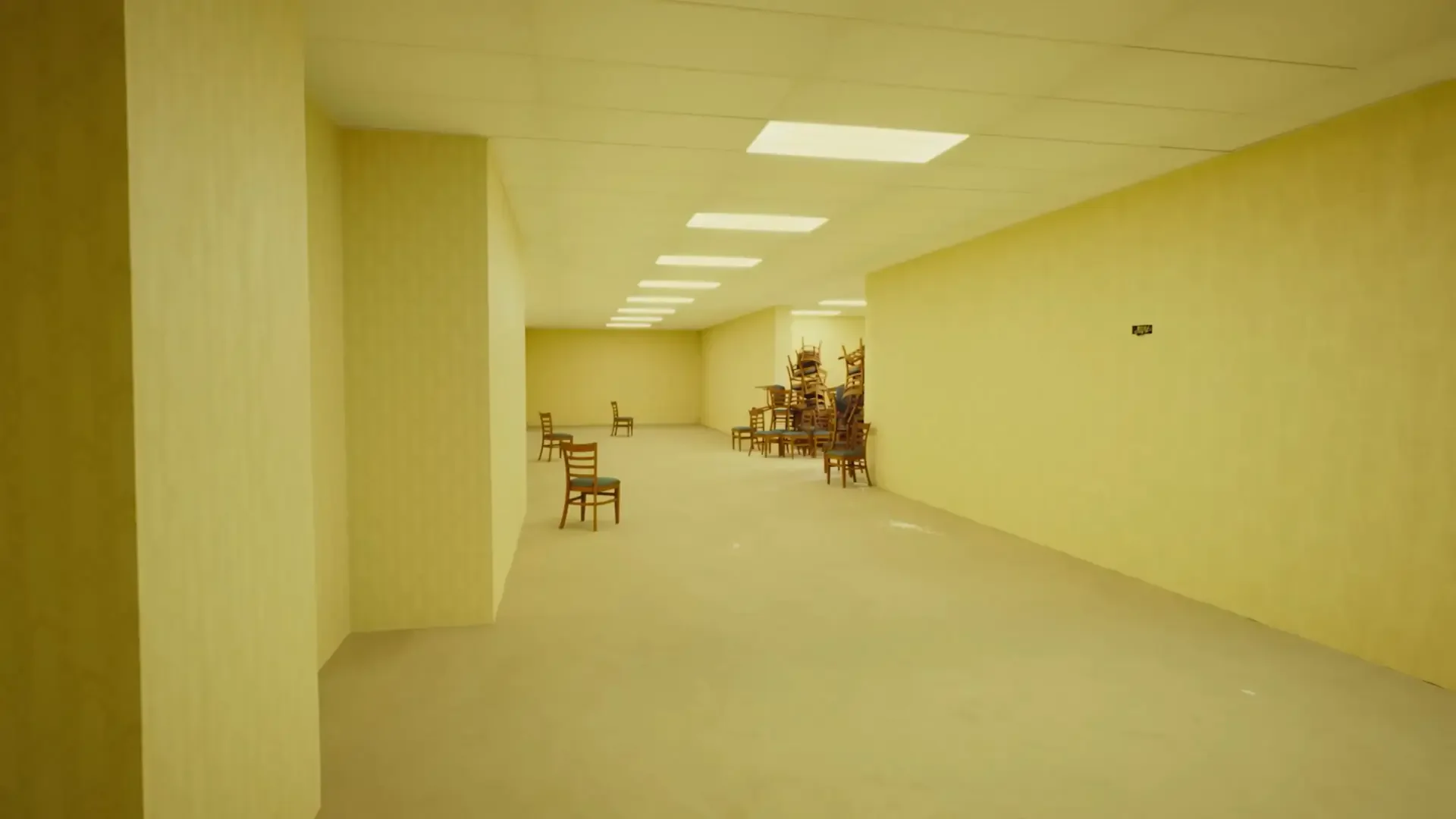 Backrooms 4K Ultra HD PC desktop wallpaper and background — long empty yellow corridor lit by fluorescent panels, scattered chairs and shelving, eerie sterile atmosphere.