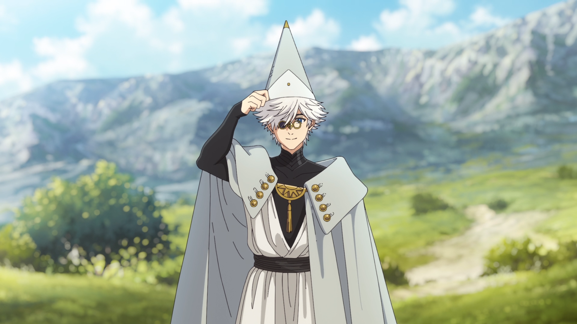 HD PC wallpaper of Qifrey (Witch Hat Atelier): anime wizard in a white cloak and tall pointed hat, adjusting it against a sunlit mountain range and green meadow backdrop.