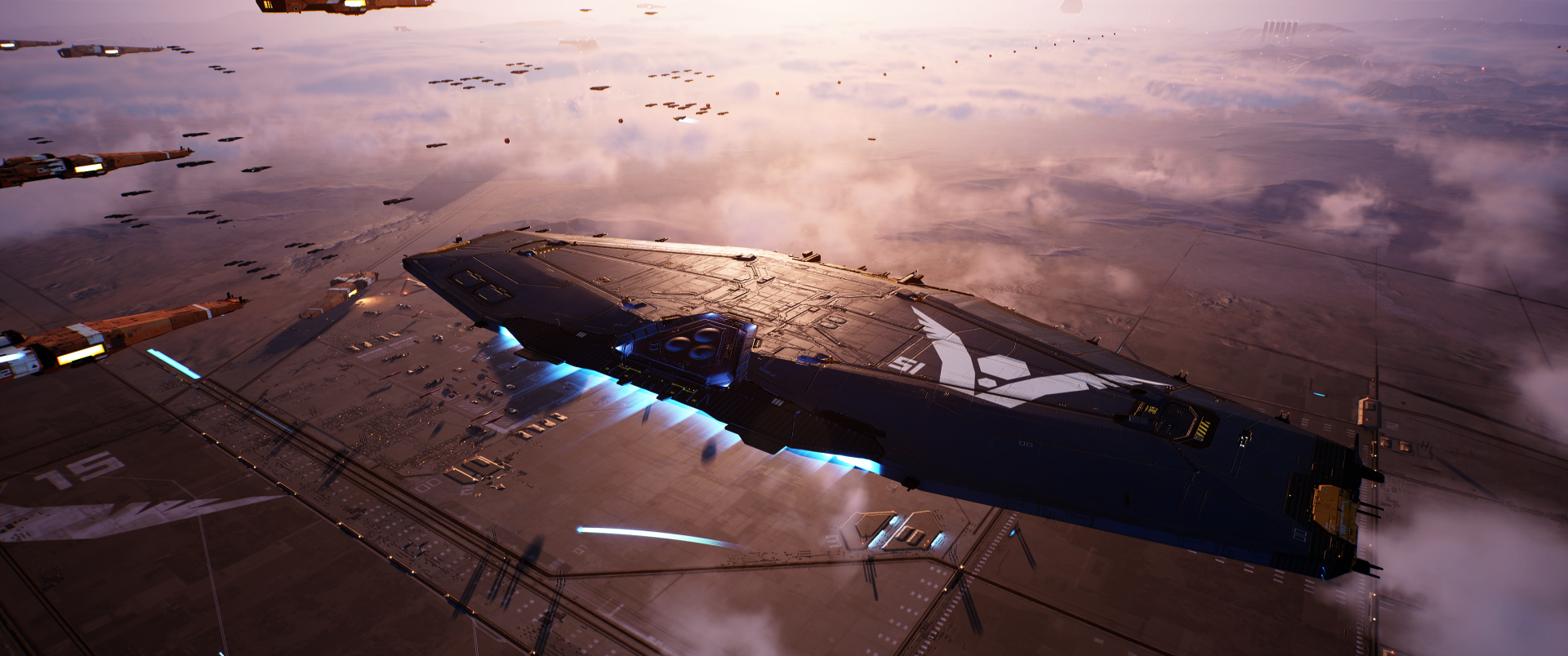 Homeworld video game 2K Quad HD PC desktop wallpaper/background: a massive capital ship hovers above a lit platform, blue engine thrusters glowing against a clouded sunset sky.