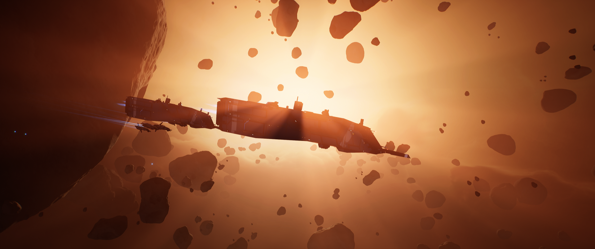 Homeworld video game 2K Quad HD PC desktop wallpaper: massive mothership moving through an orange-lit asteroid field in deep space.