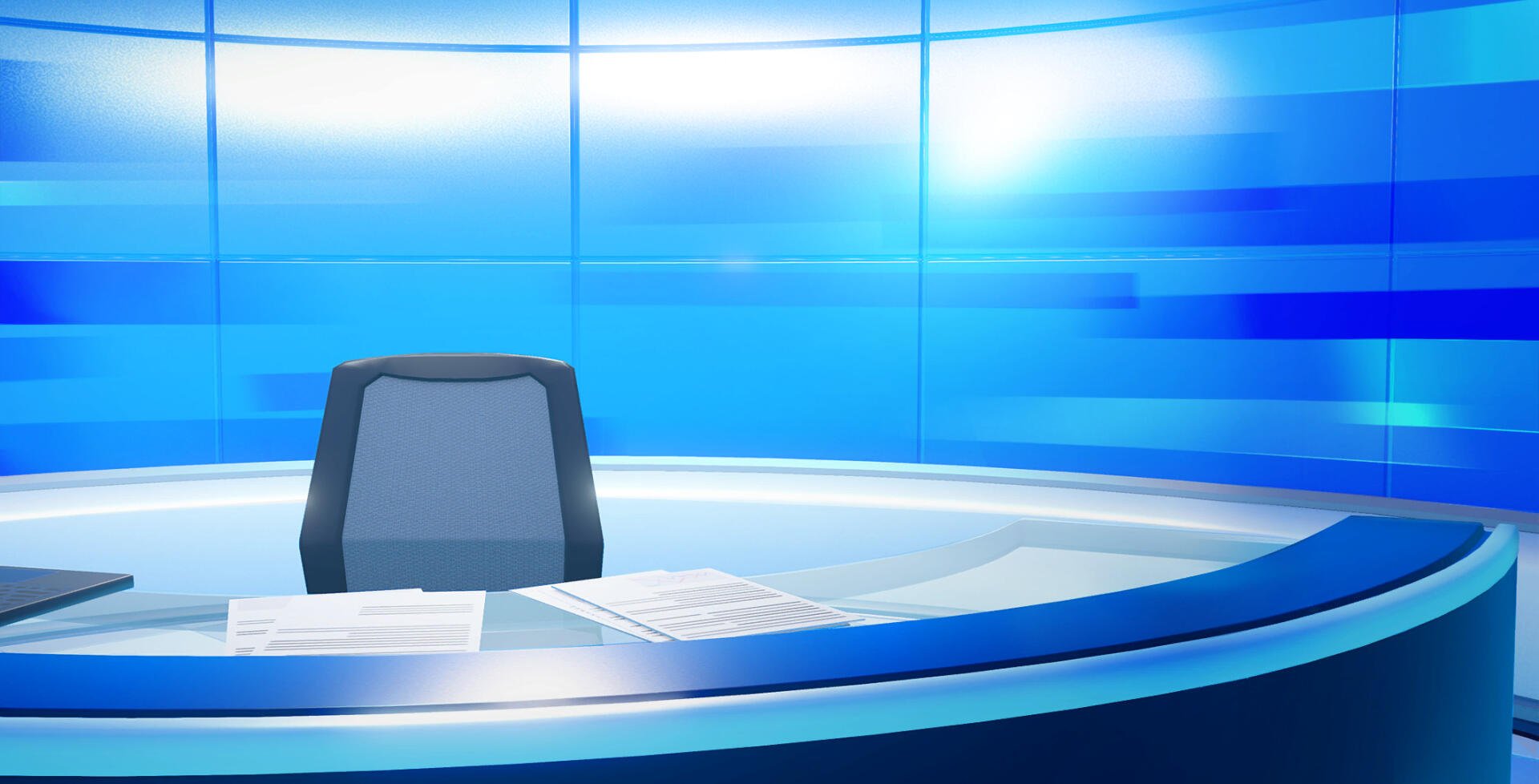 Tomodachi Life: Living the Dream HD PC desktop wallpaper showing a sleek blue broadcast desk with an empty chair and scattered papers in a bright, futuristic studio.