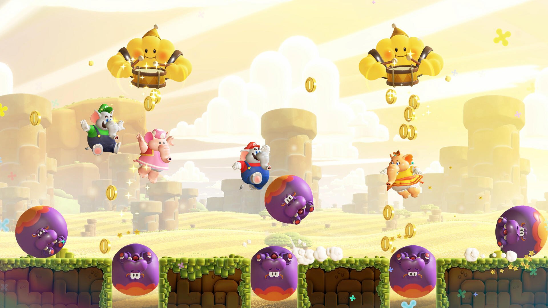 Super Mario Bros. Wonder HD PC desktop wallpaper featuring Mario, Peach and Luigi jumping across grassy platforms with purple bouncy foes, coins and winged yellow enemies under a bright sky.