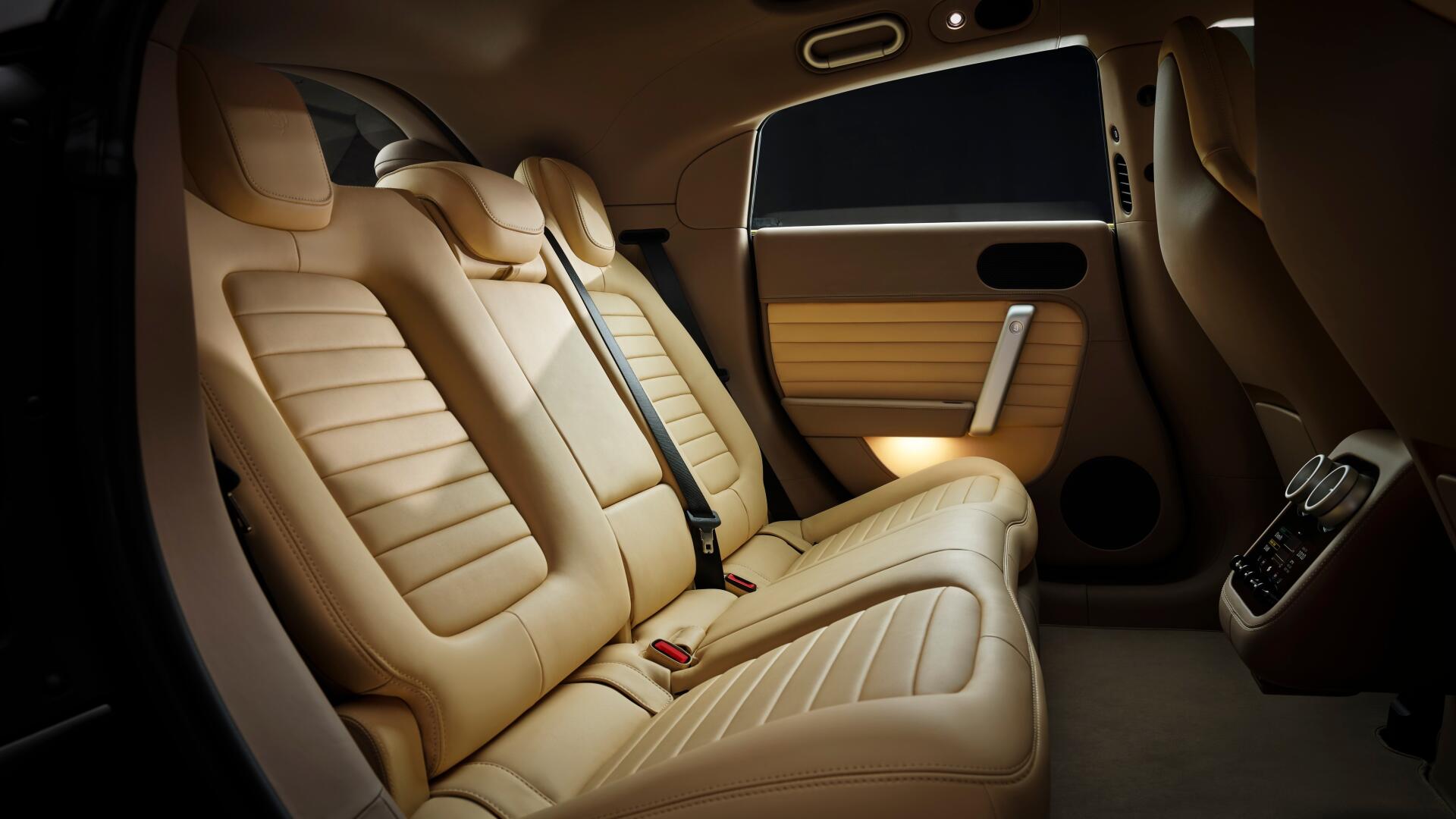 4K Ultra HD PC desktop wallpaper of a Ferrari Luce vehicle interior — plush beige rear leather seats, seatbelts, door panel and warm ambient lighting.