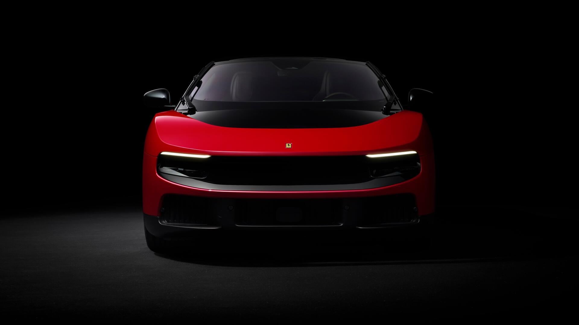 Red Ferrari Luce sports vehicle, front view in dramatic low-key lighting — 4K Ultra HD PC desktop wallpaper/background.