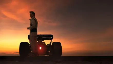 Silhouetted F1 driver beside a single-seater race car at sunset — 4K Ultra HD PC desktop wallpaper and background, F1 (2025).