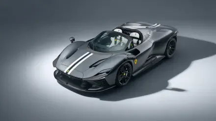 Black Ferrari Daytona SP3 with white racing stripe, three-quarter studio view on gray backdrop — 8K Ultra HD PC desktop wallpaper/background.