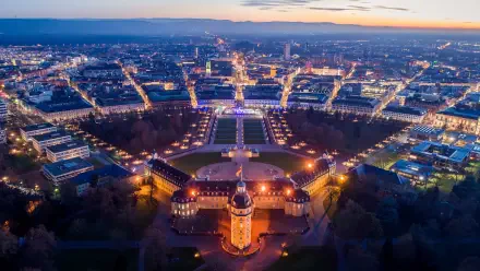 5K Ultra HD PC desktop wallpaper: aerial view of Karlsruhe, Baden-Württemberg, Germany at dusk, illuminated Karlsruhe Palace with radiating city streets.