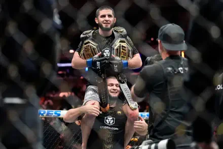 4K Ultra HD wallpaper of two UFC fighters celebrating in the octagon, one hoisted on the other's shoulders wearing championship belts as cameras capture the victory.