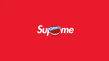 Minimalist red 8K desktop wallpaper featuring a Supreme logo with an Oreo cookie replacing the 'r' — a Supreme × Oreo crossover.