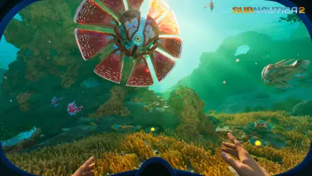 Video game Subnautica 2 4K Ultra HD PC desktop wallpaper and background: first-person underwater scene with outstretched hands, colorful coral and a large fan-like bioluminescent creature approaching.