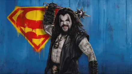 Grungy 4K Ultra HD PC desktop wallpaper for Supergirl (2026): snarling armored villain with spiked mace stands before a spray‑painted S emblem on a blue wall.