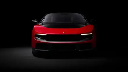 Red Ferrari Luce sports vehicle, front view in dramatic low-key lighting — 4K Ultra HD PC desktop wallpaper/background.