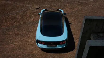 Top-down view of a pale blue Ferrari Luce on cracked earth, presented as a 4K Ultra HD PC desktop wallpaper and background.