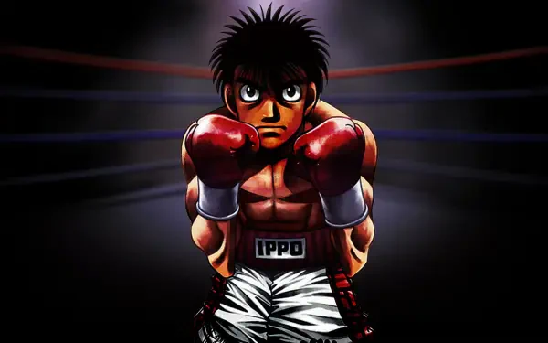Hajime no Ippo anime HD PC desktop wallpaper: Ippo stands in boxing gloves and trunks in a dim ring, spotlight behind him, intense, determined expression.