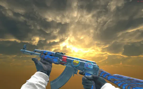 HD PC desktop wallpaper/background from the video game Counter-Strike 2 showing first-person hands gripping a blue AK-47 skin against a dramatic sunset sky.