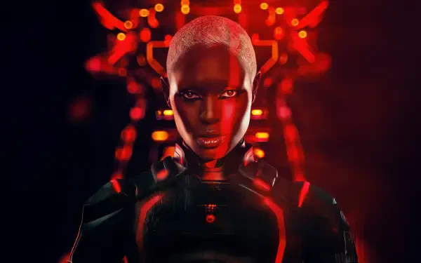 Tron: Ares — 4K Ultra HD PC desktop wallpaper of a glowing red-lit armored figure with shaved head, neon circuitry backdrop, centered and staring forward.