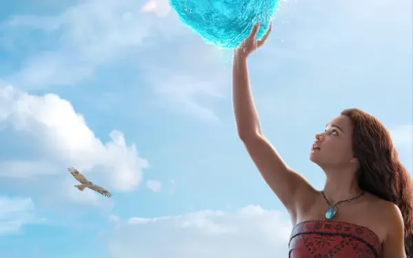 Live-action Moana reaches for a glowing sea orb against a bright blue sky — 2K Quad HD PC desktop wallpaper/background from the movie.