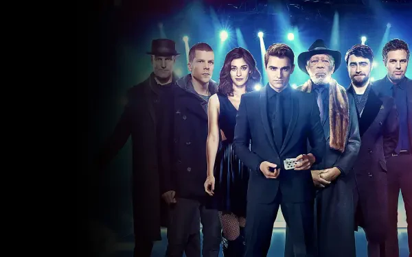 Now You See Me 2 4K Ultra HD PC desktop wallpaper: ensemble of magicians in dark suits and coats, central figure holding a card and cash under moody blue lighting.