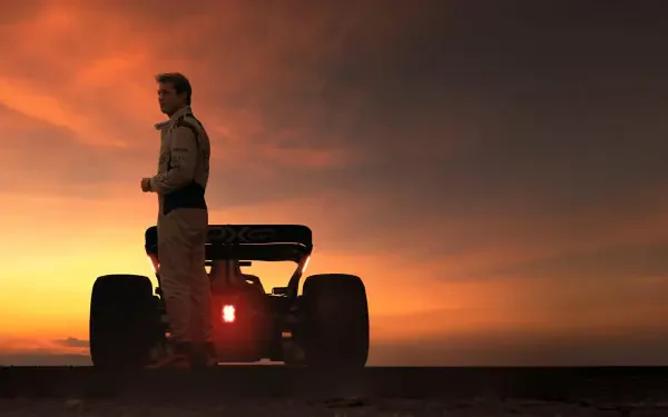 Silhouetted F1 driver beside a single-seater race car at sunset — 4K Ultra HD PC desktop wallpaper and background, F1 (2025).