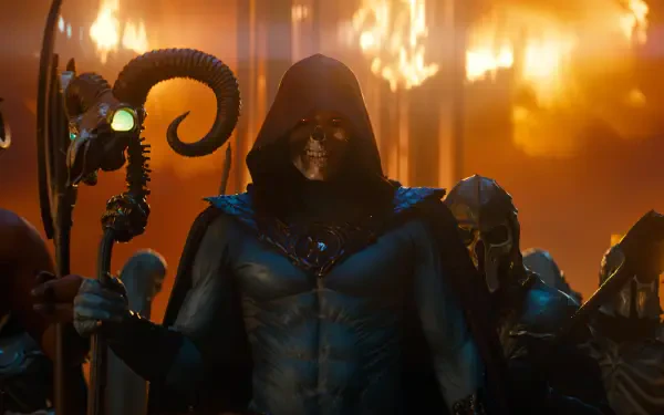 Hooded Skeletor in dark armor grips a ram‑headed staff amid roaring flames — cinematic still from Masters of the Universe (2026). 4K Ultra HD PC desktop wallpaper/background.