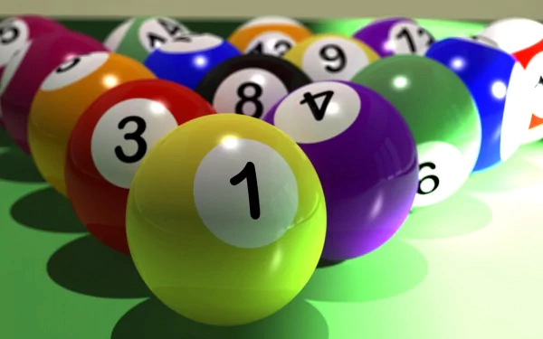 A vibrant arrangement of pool balls, including the iconic striped and solid colors, set against a green table, featuring the number 1 ball prominently in the foreground.