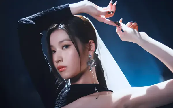 4K Ultra HD portrait wallpaper: female K-pop–inspired performer in a black outfit with long earrings, arms raised in a graceful pose against moody blue backlighting.