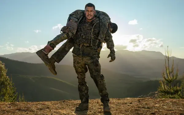 Soldier carries wounded comrade over his shoulder during mountain rescue training — War Machine (2026) movie still, 5K Ultra HD desktop wallpaper