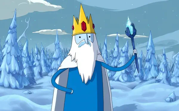 HD PC desktop wallpaper of Ice King from the TV show Adventure Time — a bearded, blue-robed king holding an icy staff amid snow-covered trees and a cloudy winter sky.