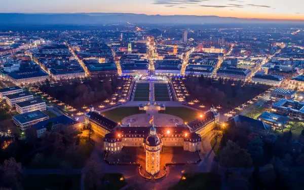 5K Ultra HD PC desktop wallpaper: aerial view of Karlsruhe, Baden-Württemberg, Germany at dusk, illuminated Karlsruhe Palace with radiating city streets.