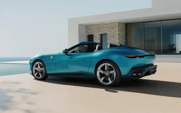 Teal Ferrari Amalfi Spider luxury car parked by a modern villa and pool, 4K Ultra HD PC desktop wallpaper and background.