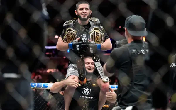 4K Ultra HD wallpaper of two UFC fighters celebrating in the octagon, one hoisted on the other's shoulders wearing championship belts as cameras capture the victory.