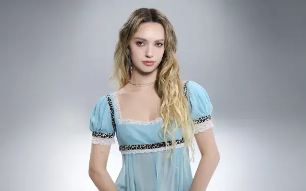 Pop music artist portrait in a pale blue dress for a Katseye-themed 5K Ultra HD PC desktop wallpaper, soft studio lighting and neutral gradient background.