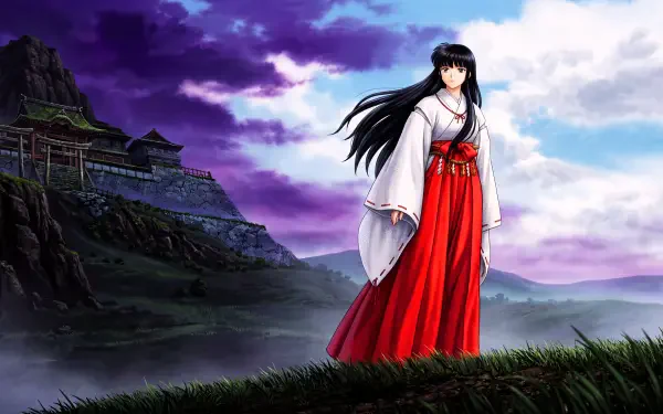 Kikyō (InuYasha), a fantasy anime priestess in white kimono and red hakama, stands on a grassy hill before a feudal Japan fortress under a purple-blue sky — 5K Ultra HD PC wallpaper.